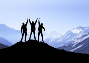 Silhouette of team in mountains